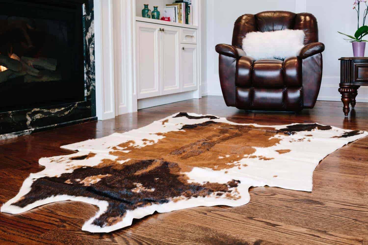 cowhide rug below kitchen table