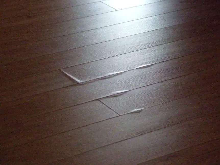 Why Is My Vinyl Plank Floor Buckling, How To Replace Damaged Vinyl Flooring Planks