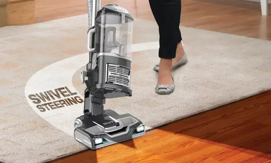 vacuuming carpet and wood floor
