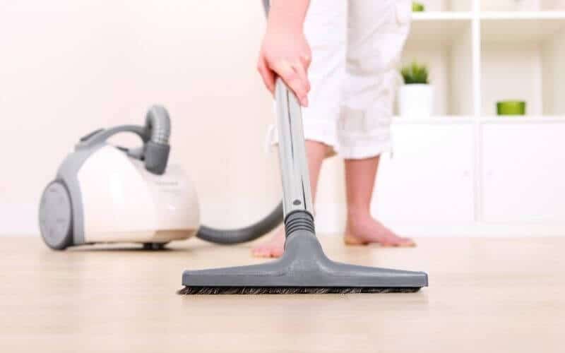 lady vacuuming floor