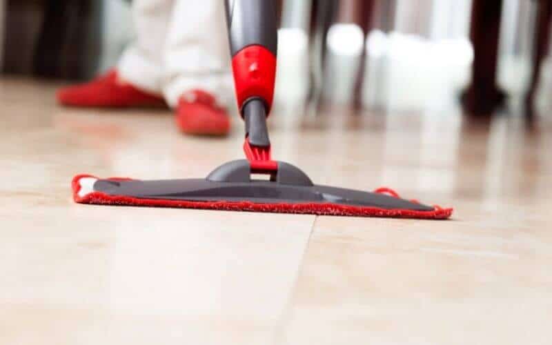 mopping dirt off tile floor