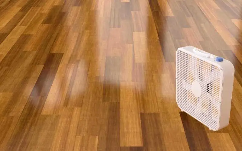 box fan on wood floor