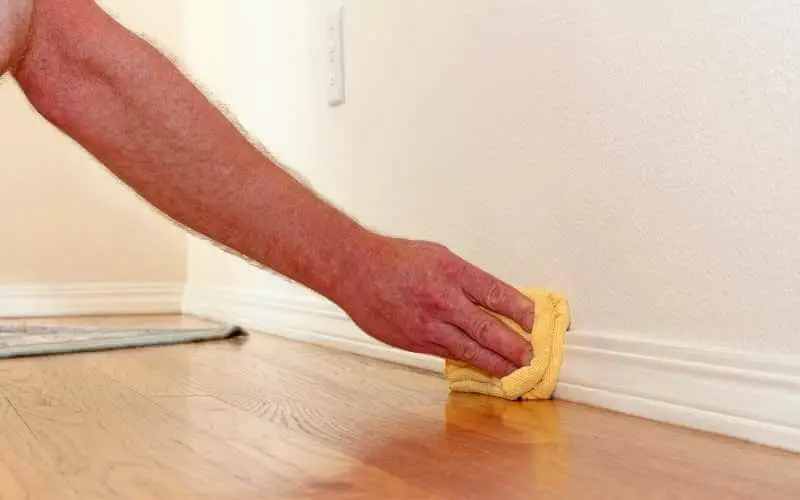 cleaning hardwood floor baseboard