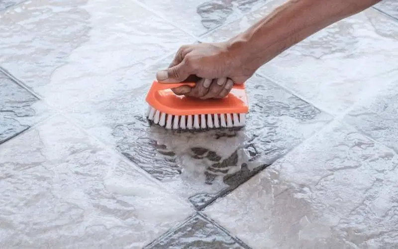 how long do you wait to clean tiles after grouting